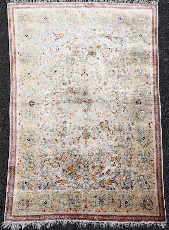 A Persian silk rug, 6ft 8in by 4ft 2in.